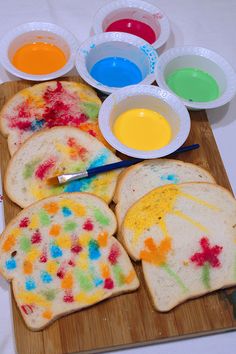 the bread is covered in colorful paint and has been cut into pieces