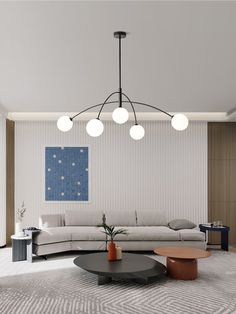 a modern living room with white couches and round coffee tables