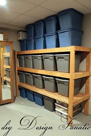 the shelves are filled with plastic buckets and bins for storing items or other things