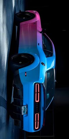 the rear end of a blue sports car