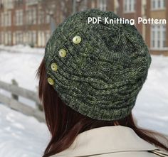 a woman wearing a green knitted hat with buttons on the side and behind her head