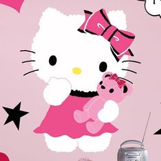 a hello kitty wall sticker with a pink teddy bear and stars on the background