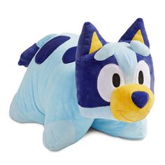 a blue and yellow stuffed animal laying on top of it's back with its eyes closed