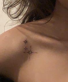 a woman with a cross tattoo on her chest