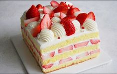 a piece of cake with strawberries on top