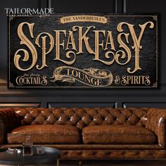 a leather couch sitting in front of a wooden sign that says speakeasy lounge and spirits