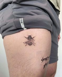 a man with a tattoo on his thigh