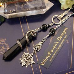 a keychain with a pen on top of it next to some other items