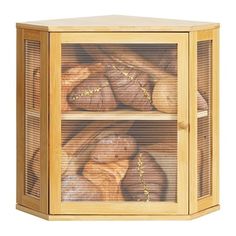 a wooden cabinet filled with lots of bread