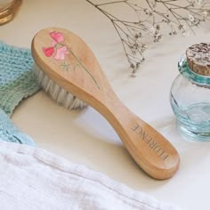 A personalised hair brush with Nessie's birth flower illustrations makes a wonderful gift for a new baby whether it's a birthday gift or a christening gift. Made from premium materials that are non-toxic and safe to use, use to detangle baby's hair and stimulate the scalp whilst relaxing your baby. Made From: Natural non-toxic materials.  The brush handle is made from wood. Dimensions: 3.2cm x 15cm August Poppy, February Violet, Baby Hair Brush, Snow Drop, Month January, Flower Illustrations, Gentle Baby, Wellies Boots, Goat Hair