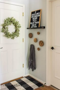 the entryway is clean and ready for guests to use it as a coat rack