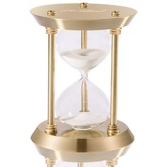 an hourglass with sand running through it on a white background in front of a gold plated stand