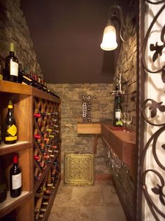 a wine cellar with lots of bottles in it