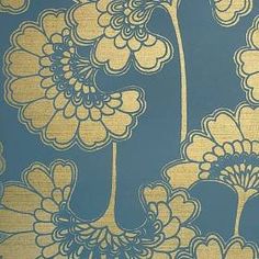 a blue and yellow wallpaper with flowers on it