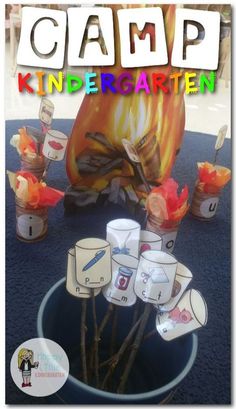 a blue bucket filled with cards sitting on top of a table next to a pumpkin