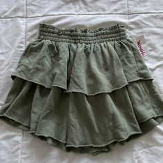 Aerie Olive Green Ruffle Flowy Tiered Athleisure Sweat Mini Skirt Size Xs Tiktok Viral New With Tags/ Never Worn Went Viral On Tiktok Last Year Two Layers Of Ruffles Stretchy, Elastic Waistband Cotton Material With Terrycloth Inside See Photos For Approximate Measurements Waistband Is Very Stretchy And Can Stretch More Than The Measurement In The Photo Skirt Is Also Available In Light Gray In This Size On My Page! Workout, Exercise, Fitness, Athletic, Athletic Wear, Active, Activewear, Gym, Spor Green Ruffle Skirt, Casual Green Ruffled Bottoms, Casual Ruffled Mini Skirt, Casual Green Pleated Skirt, Casual Short Ruffled Skirt, Casual Stretch Ruffled Skirt Bottoms, Casual Stretch Skirt With Ruffles, Casual Ruffled Stretch Skirt, Casual Short Pleated Skirt