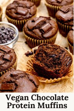 Many vegan double chocolate protein muffins are on brown parchment paper. One in the front is unwrapped and cut in half so you can see the texture. A small bowl of chocolate chips are next to the muffins. Text on the image reads, "vegan chocolate protein muffins". Vegan Chocolate Chip Muffins, Muffins Chocolate Chip, Vegan Chocolate Muffins, Muffin Vegan, Nora Cooks, Vegan Breads, Double Chocolate Chip Muffins, Healthy Vegan Dessert, Chocolate Muffin Recipe