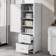 a white cabinet with drawers in a bathroom