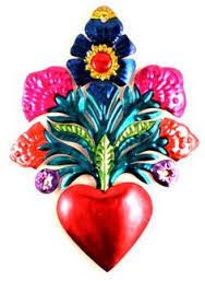 a red heart with flowers on it and a flower arrangement in the shape of a heart