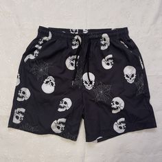 Express Your Gothic Style With These Romwe Shorts Featuring A Skull And Spider Web Graphic Design. The Drawstring Waist And Elastic Waistband Provide A Comfortable Fit, While The Lightweight Material Is Perfect For Any Season. These Unisex Shorts Also Come With Slash Pockets To Store Your Essentials While On The Go. Ideal For Travel And Casual Occasions, These Mid-Rise Shorts Have A 6-Inch Inseam And Fit Athletic Bodies. Made Of 97/3 Polyester/Elastane Material, They Are Machine Washable For Eas Halloween Streetwear Short Bottoms, Black Shorts For Halloween Streetwear, Emo Cotton Bottoms For Halloween, Halloween Emo Style Cotton Bottoms, Halloween Emo Cotton Bottoms, Gothic Summer Shorts For Streetwear, Black Emo Bottoms For Halloween, Black Rave Style Shorts, Black Emo Style Bottoms For Summer