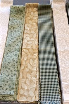 four different colored ties sitting on top of a counter next to each other in a row