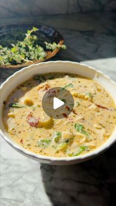 a bowl filled with soup sitting on top of a table