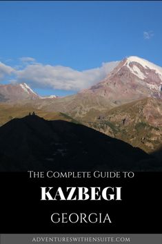 the complete guide to kazegi, georgia with mountains in the background and text overlay