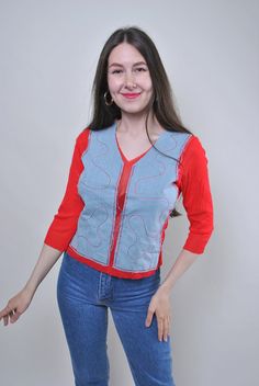 Add a pop of color to your summer wardrobe with this vintage 90s red blouse. Featuring quarter sleeves and a fun, unique design, this blouse is perfect for adding a playful touch to your outfit. Size: S Measurements (approximate): Sleeve: 32cm / 12.59 inches (from armpit to end of sleeve) Width: 36cm / 14.17 inches Length: 53cm / 20.86 inches All measurements are taken seam to seam while lying flat. Please note that as this item is vintage, it may have some defects, adding to its character. Addi Retro V-neck Summer Shirt, Fun Red Tops For Fall, Fun Long Sleeve Summer Tops, Fun Long Sleeve Summer Shirt, Fun Long Sleeve Shirt For Summer, Red Half Sleeve Shirt For Summer, 90s Red Long Sleeve Tops, 90s Inspired Short Sleeve Shirt For Spring, Red Retro Long Sleeve Top