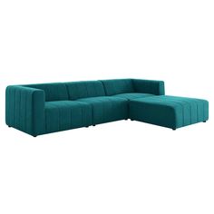 a blue sectional couch sitting on top of a white floor