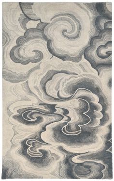 an abstract rug with swirls and clouds in grey, white and blue colors on the ground