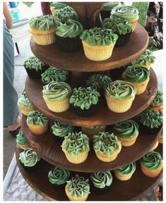 three tiered cupcake display with green frosting