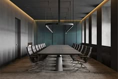 an empty conference room with long tables and chairs in the middle, along with hanging lights