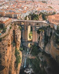 an aerial view of a bridge over a canyon