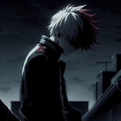 a man with red hair standing in front of a dark cityscape at night