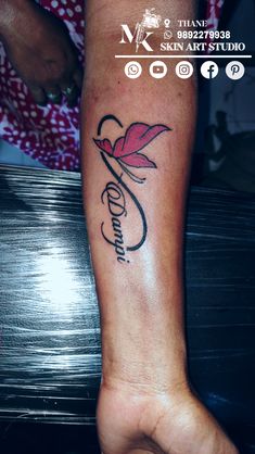 a woman's foot with a tattoo on it and the word love written in cursive writing