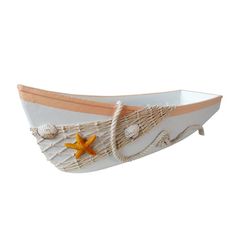 a white boat with a star on the side and rope around it's hull