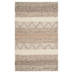 an area rug with different colors and patterns on the floor, including beiges and browns