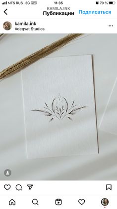 an image of a white card with black ink on it and the words kalma ink adevative studios in russian