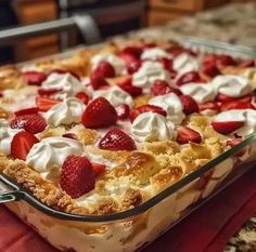 a dessert dish with strawberries and whipped cream