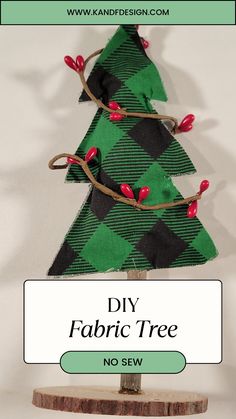 a christmas tree made out of fabric with the words diy fabric tree no sew