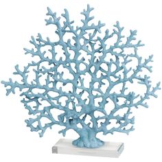 a blue coral sculpture sitting on top of a white base