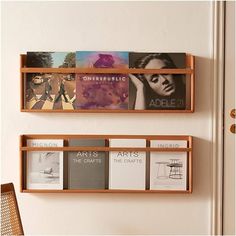 two wooden shelves with books on them