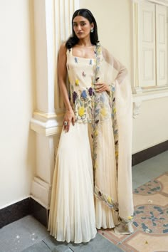 Buy Beige Sharara Pant And Bustier Modal Bletilla Resham Bloom Cape Set For Women by Roqa Online at Aza Fashions. One Shoulder Sharara Suit, Floral Indian Suit, Cream Embroidered Dress, Sharara Sleeveless, Sangeet Dress For Bride Sister, A Line Sharara, Modern Kurta Designs Women, Indowestern For Women, Sleeveless Sharara