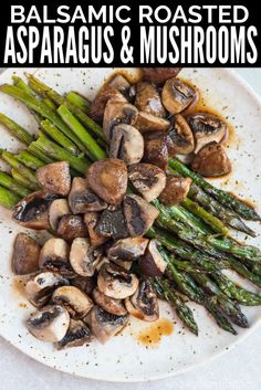 asparagus and mushrooms on a white plate with balsamic roasted asparagus