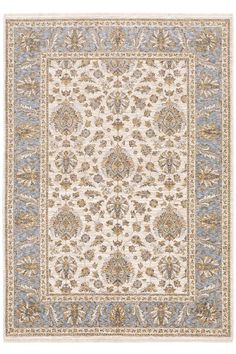 a beige and blue rug with an ornate design on the bottom, in front of a white background