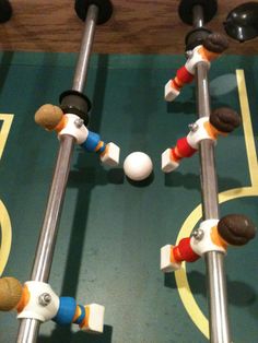 a close up of two metal poles with balls on them