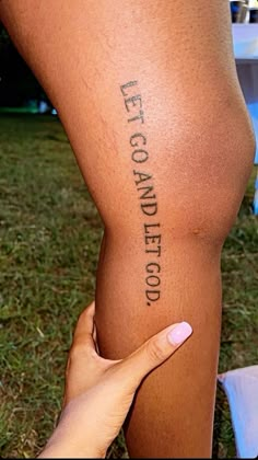 a woman's leg with words written on it