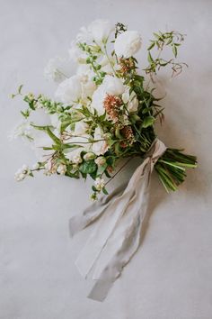 a bouquet of white flowers on a table