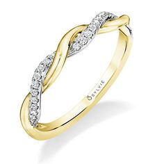 a yellow and white gold ring with diamonds