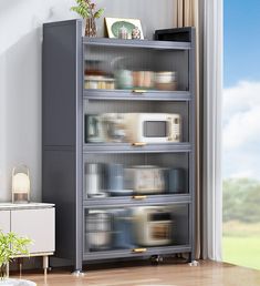 a metal shelf filled with lots of items next to a window in a living room